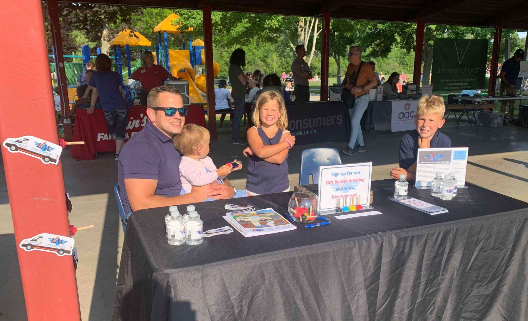 Summer event with man and children.